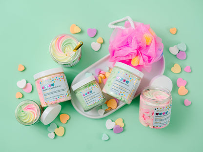 Jars with candy pieces and a whipped swirl arranged on mint.