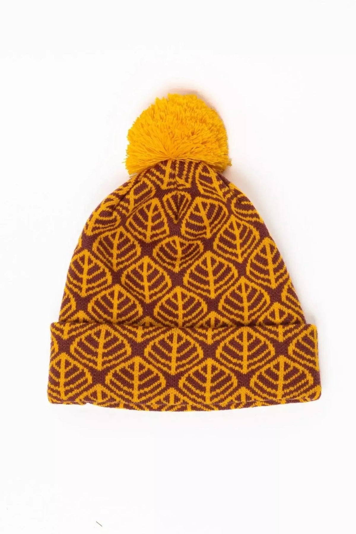 Burgundy knit beanie with a golden leaf pattern, a deep cuff and a mustard pom pom
