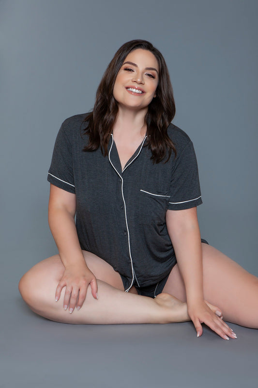 Charcoal knit pajama set, seated front view showing the notched collar and chest pocket