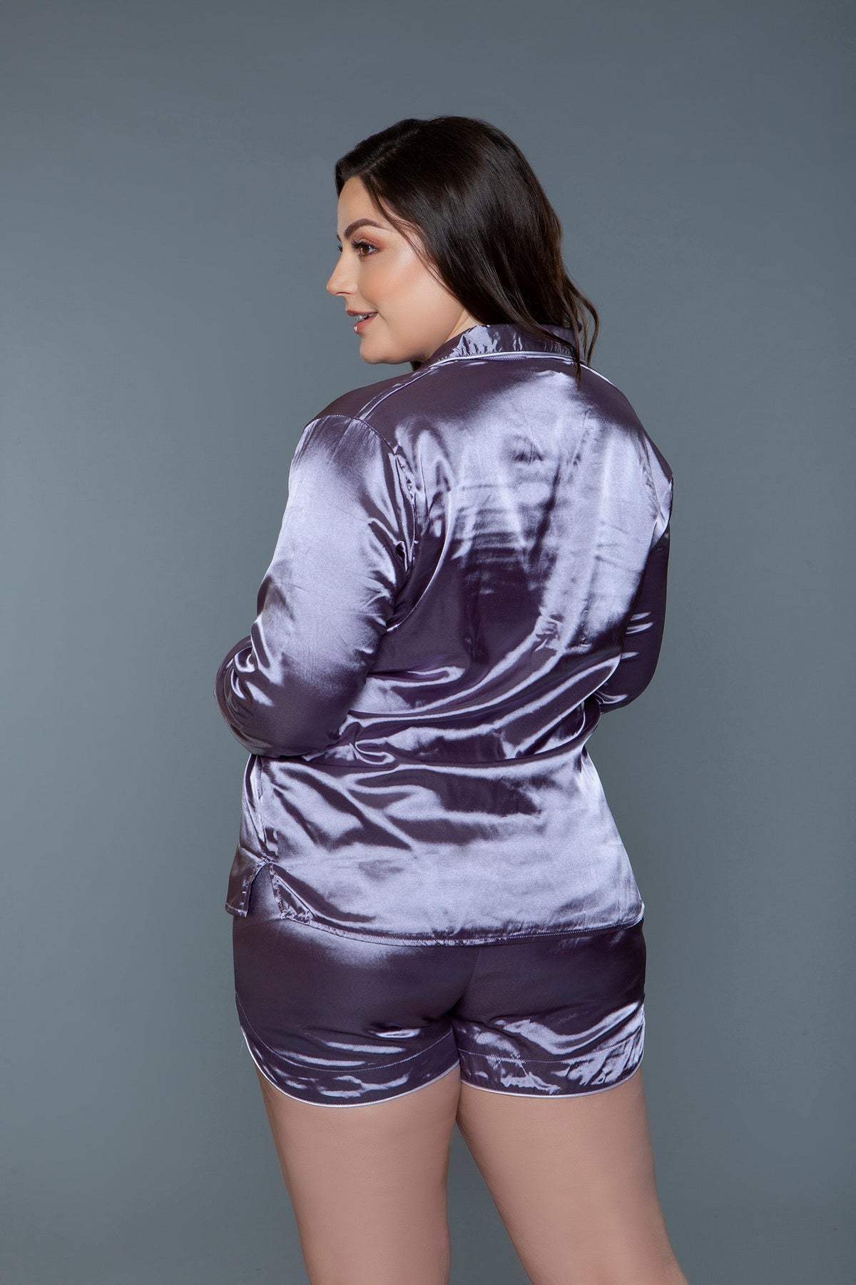 Lilac satin pajama set, back view showing the long sleeves and dolphin hem shorts