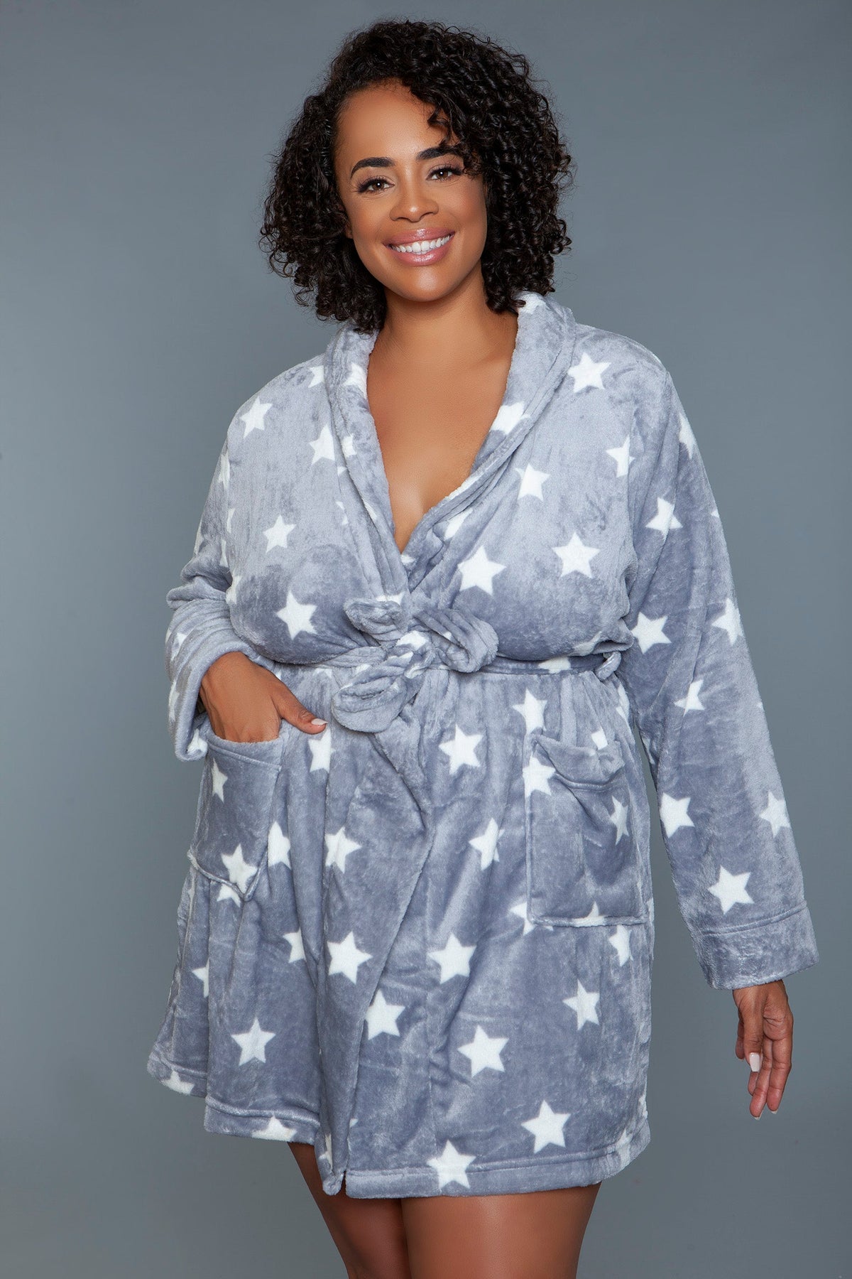 Plush shawl collar robe in dark gray with white star print, front view with one hand in a pocket