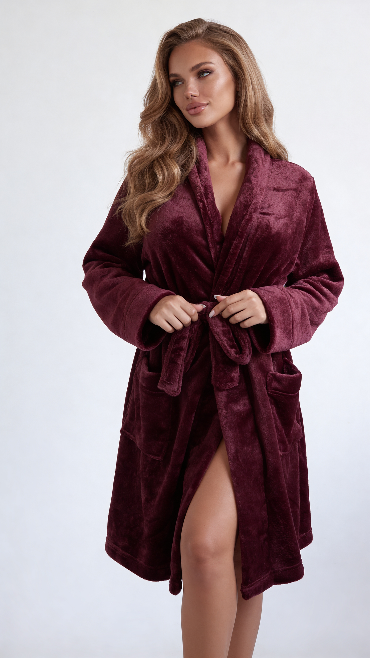 Plush shawl collar robe in burgundy, front view with the belt held loosely at the waist