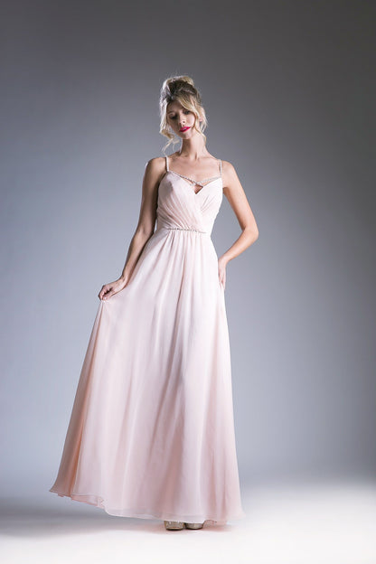 Blush V-neck evening gown with spaghetti straps and a beaded waistband.