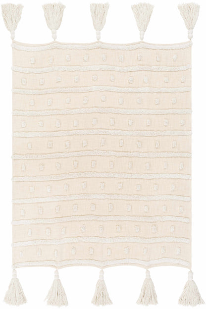 Flat view of the cream cotton throw blanket with rows of tufted dots and five tassels on each short end