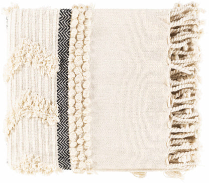 Folded ivory boho cotton throw blanket showing tufted loops, a dark herringbone stripe and chunky knotted fringe