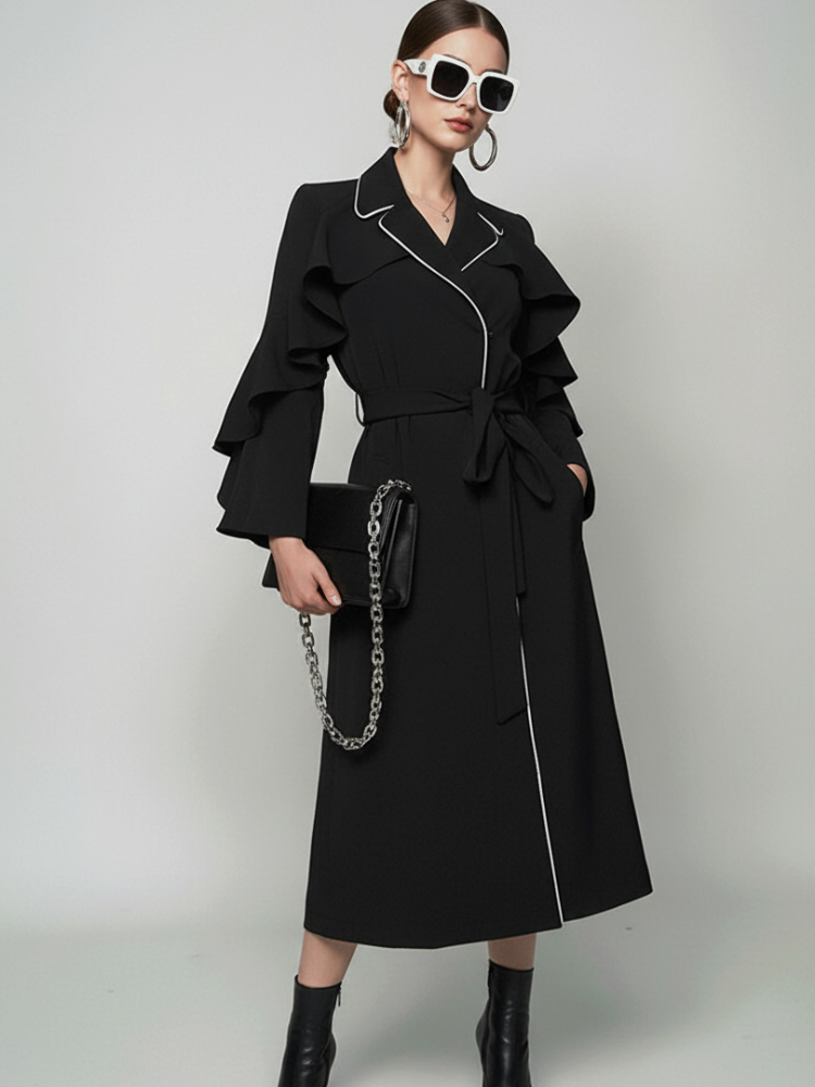 BYMANYC New York ruffle long coat with contrast piping, shown on a model.