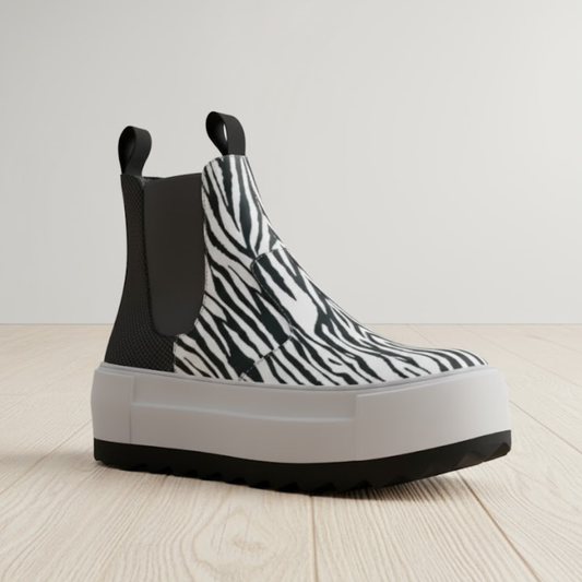 Black and white animal print vegan Chelsea boots by BYMANYC New York with elastic side panels.