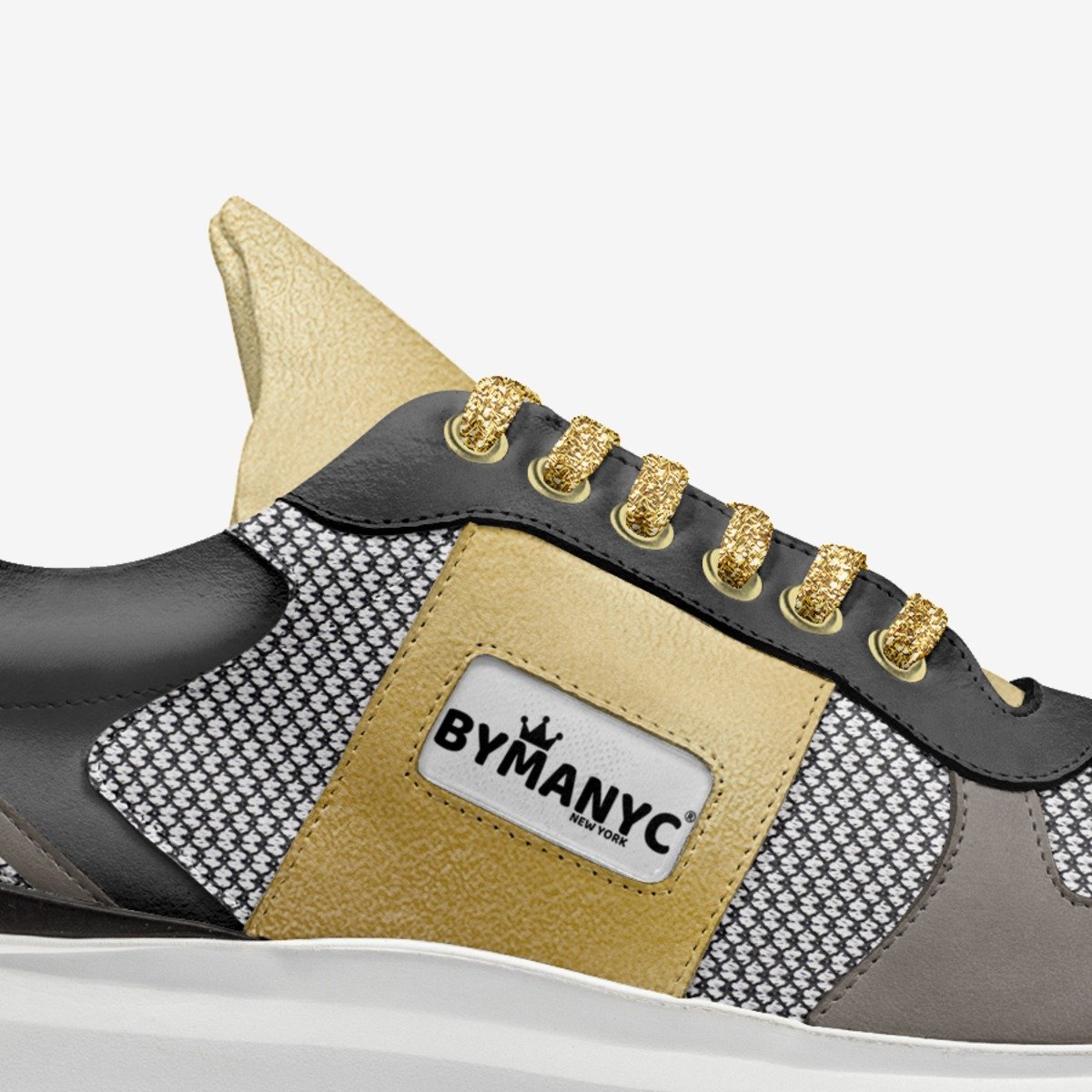Gold vegan sport sneaker by BYMANYC New York with a lace fastening and a lightweight white sole.