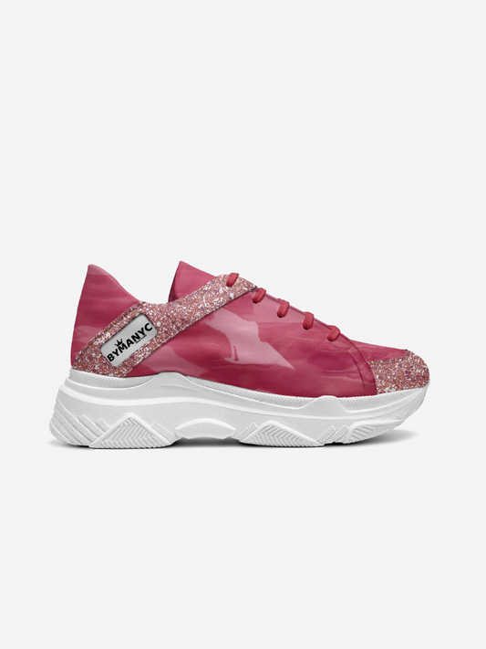 Pink vegan sneakers by BYMANYC New York on a chunky white sole, side view.