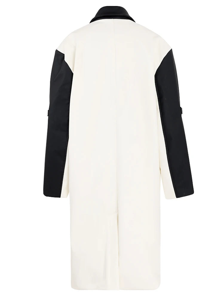 Women's faux leather color-splicing trench coat by BYMANYC New York, close view of a spliced panel.