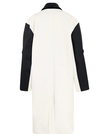 Women's faux leather color-splicing trench coat by BYMANYC New York, close view of a spliced panel.