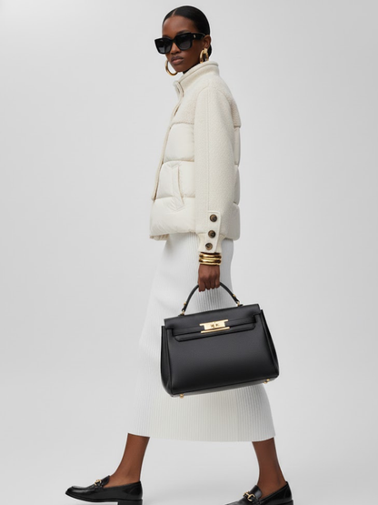 Women's longline asymmetric coat by BYMANYC New York, close view of the off-center closure.
