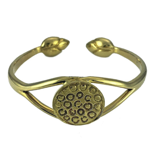 Lotus cuff bracelet in polished brass, front view of the seed pod disc and the two bud tips