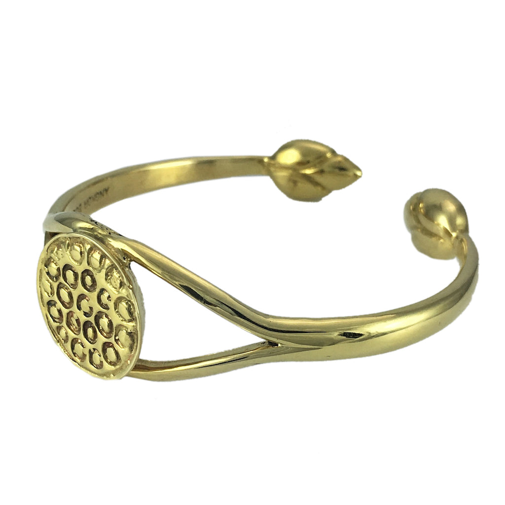 Lotus cuff bracelet in brass turned to the side, showing the split band and one bud tip