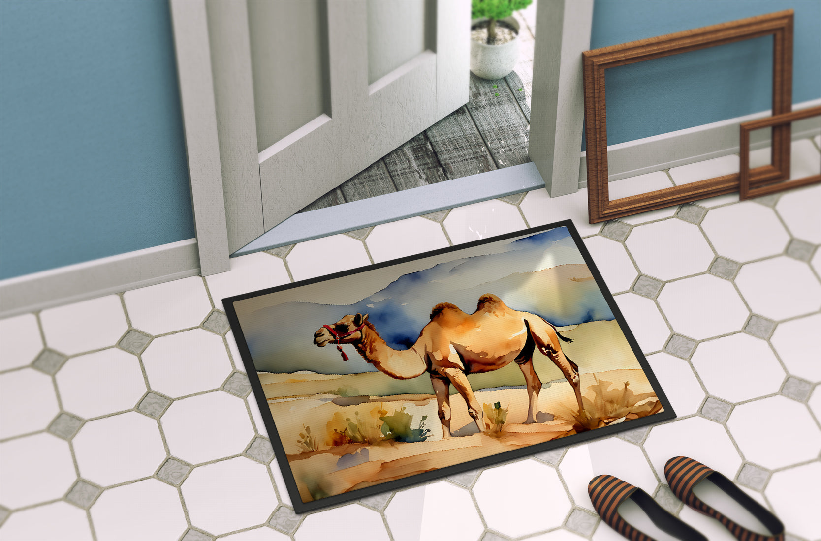 The 18 by 27 inch Camel artwork doormat lying on hexagonal floor tiles just inside an open door.