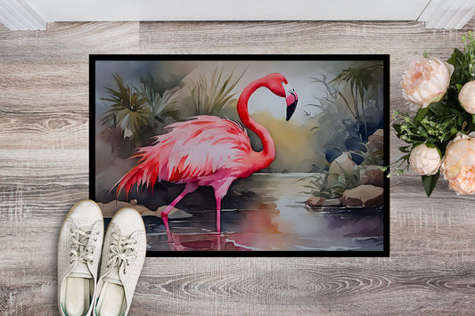 The 24 by 36 inch Flamingo artwork doormat seen from above on pale wood boards, a pair of shoes at its edge for scale.