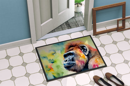 The 18 by 27 inch Gorilla artwork doormat lying on hexagonal floor tiles just inside an open door.
