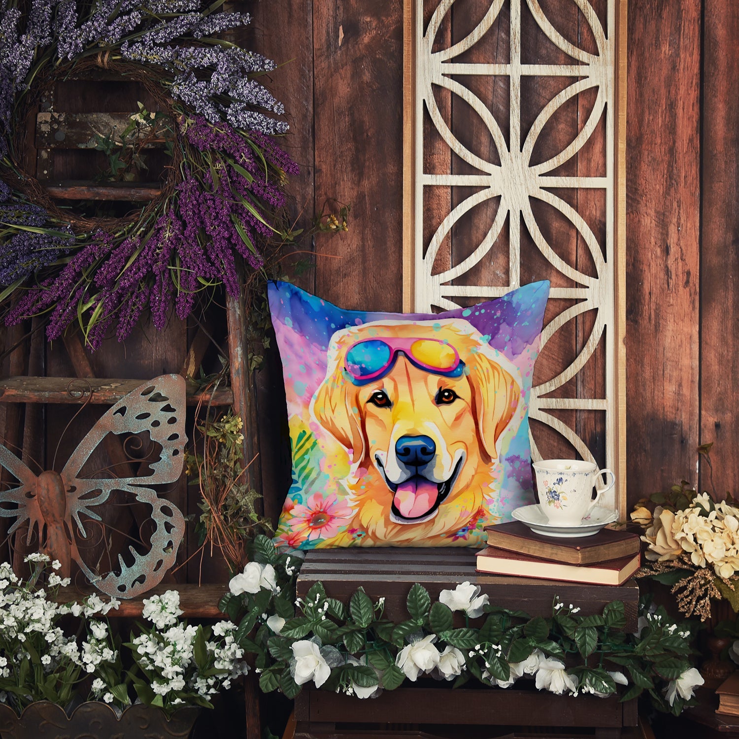 The Yellow Labrador artwork pillow on an outdoor sofa beside a pool, with loungers and parasols behind it.