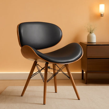 Dining chair in black faux leather on Eiffel style splayed walnut legs.