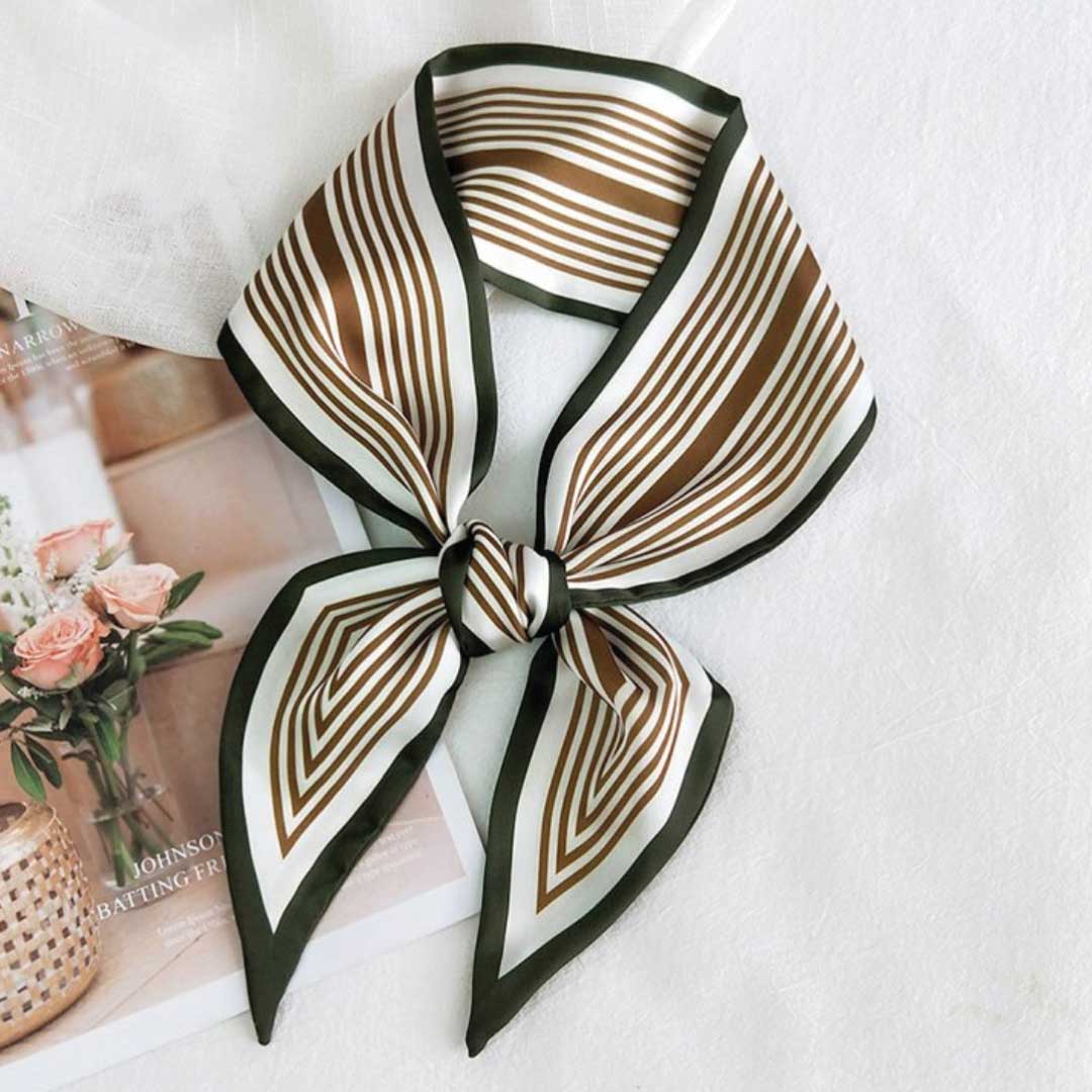 Olive colorway, a narrow silk neck scarf with brown stripes on cream and a dark olive edge, knotted