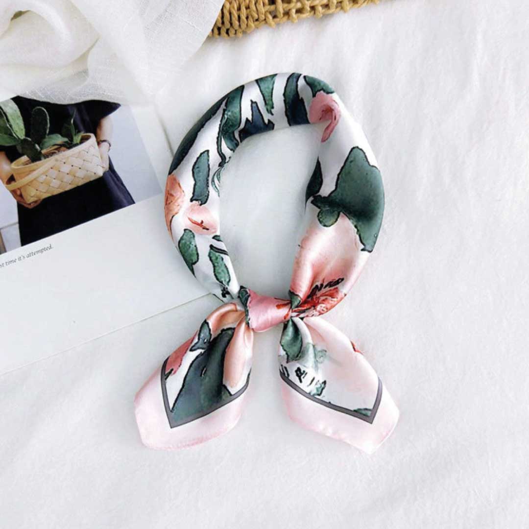 Rose colorway folded and knotted into a loop with two pointed ends, the way it sits at the neck