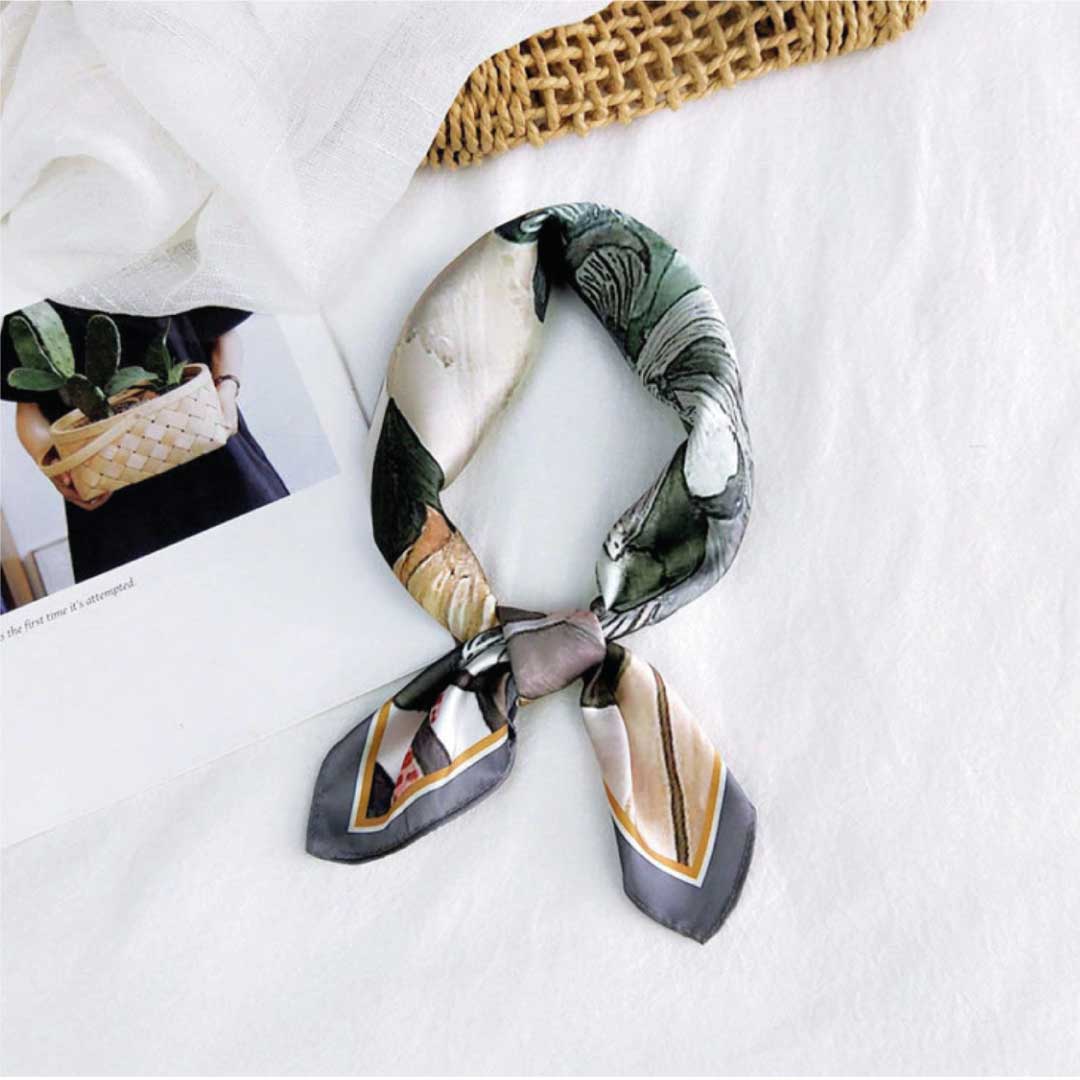 Gray colorway folded and knotted into a loop, the slate border showing at both tips