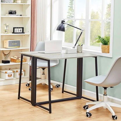 Foldable desk in gray with gold finished legs at a working height of 29.52 inches.