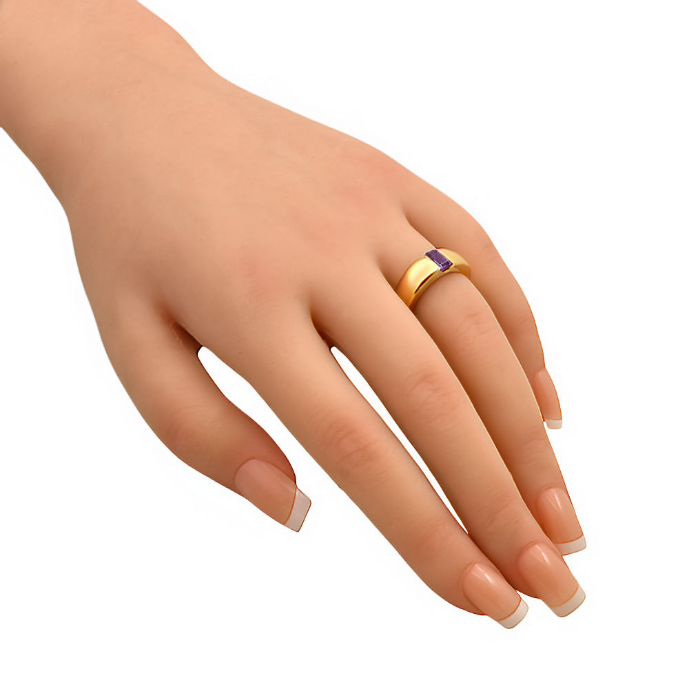 Wide gold plated band with an amethyst baguette worn on a hand