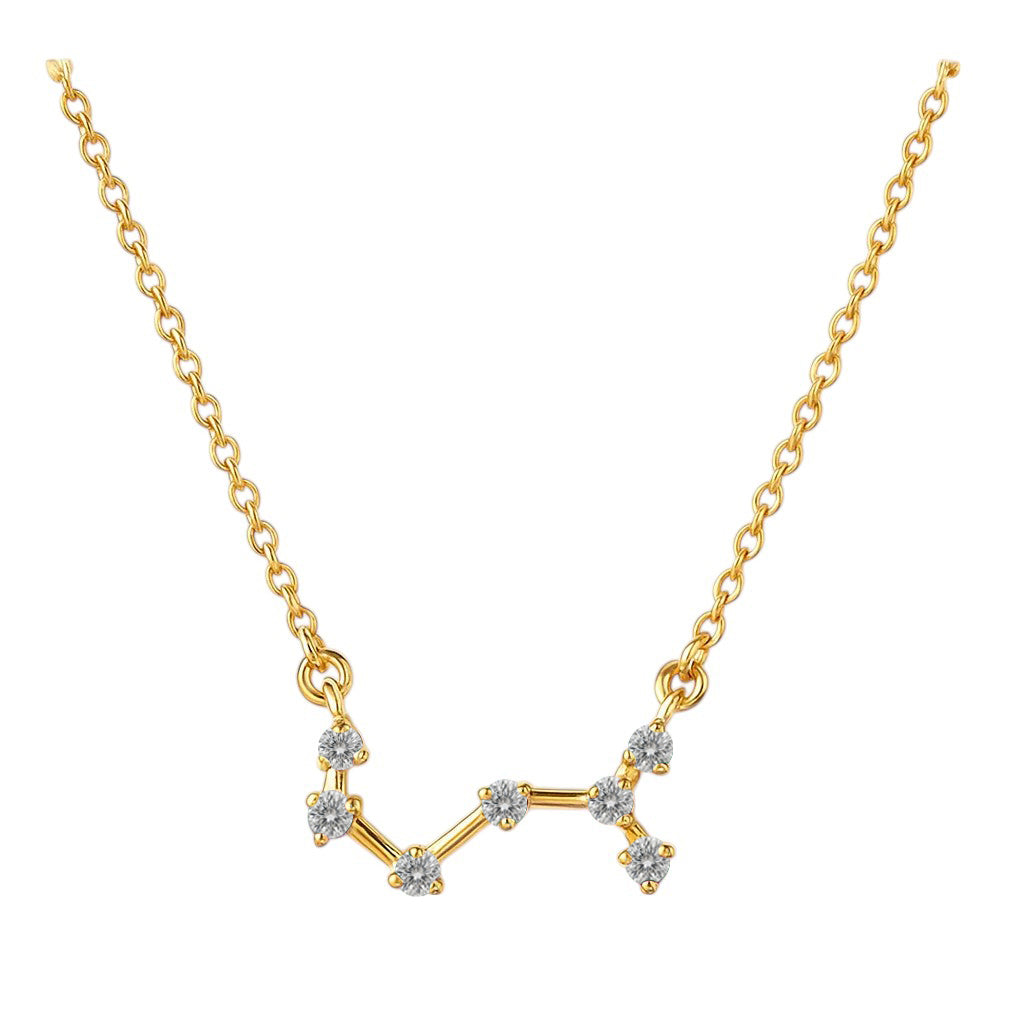 White zircon version on white, seven small clear stones joined by short gold tone bars