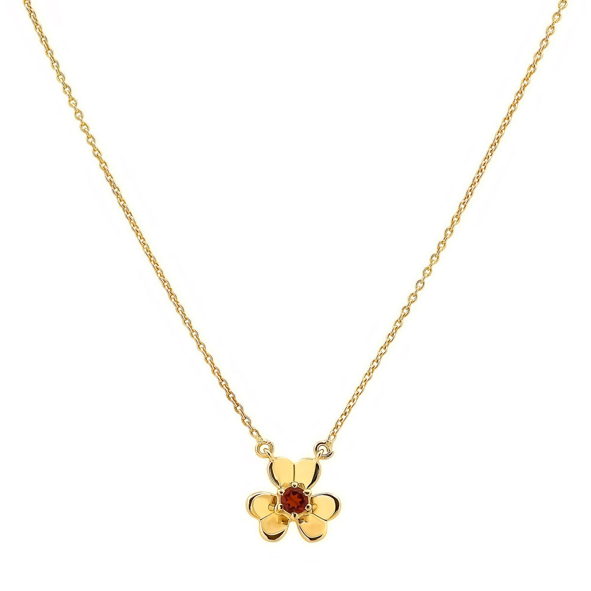Garnet version on white, a small red stone in prongs at the heart of three gold tone petals