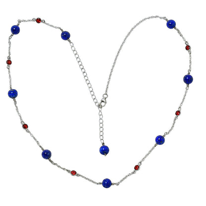 Garnet version laid flat, lapis beads along the chain and the extender ending in a lapis bead