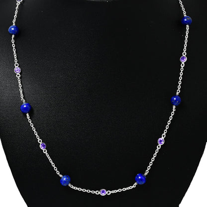 Amethyst version on a black display, blue lapis beads alternating with small purple stones