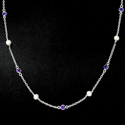 Amethyst version on black, white pearls alternating with small purple bezel set stones