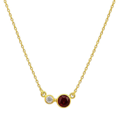 Garnet version on white, a round bezel set red stone beside a small clear accent stone