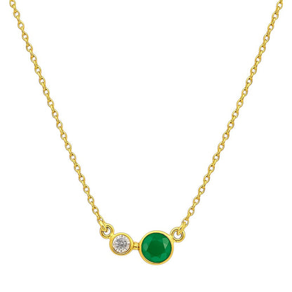 Green onyx version on white, a round bezel set green stone beside a small clear accent stone