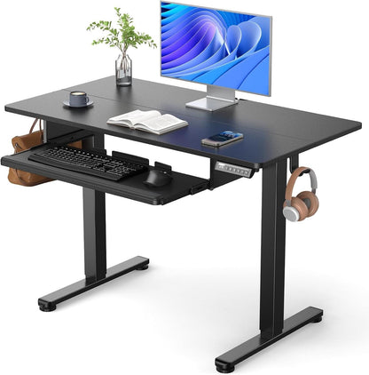 Electric standing desk on a steel frame lowered to its sitting height position.