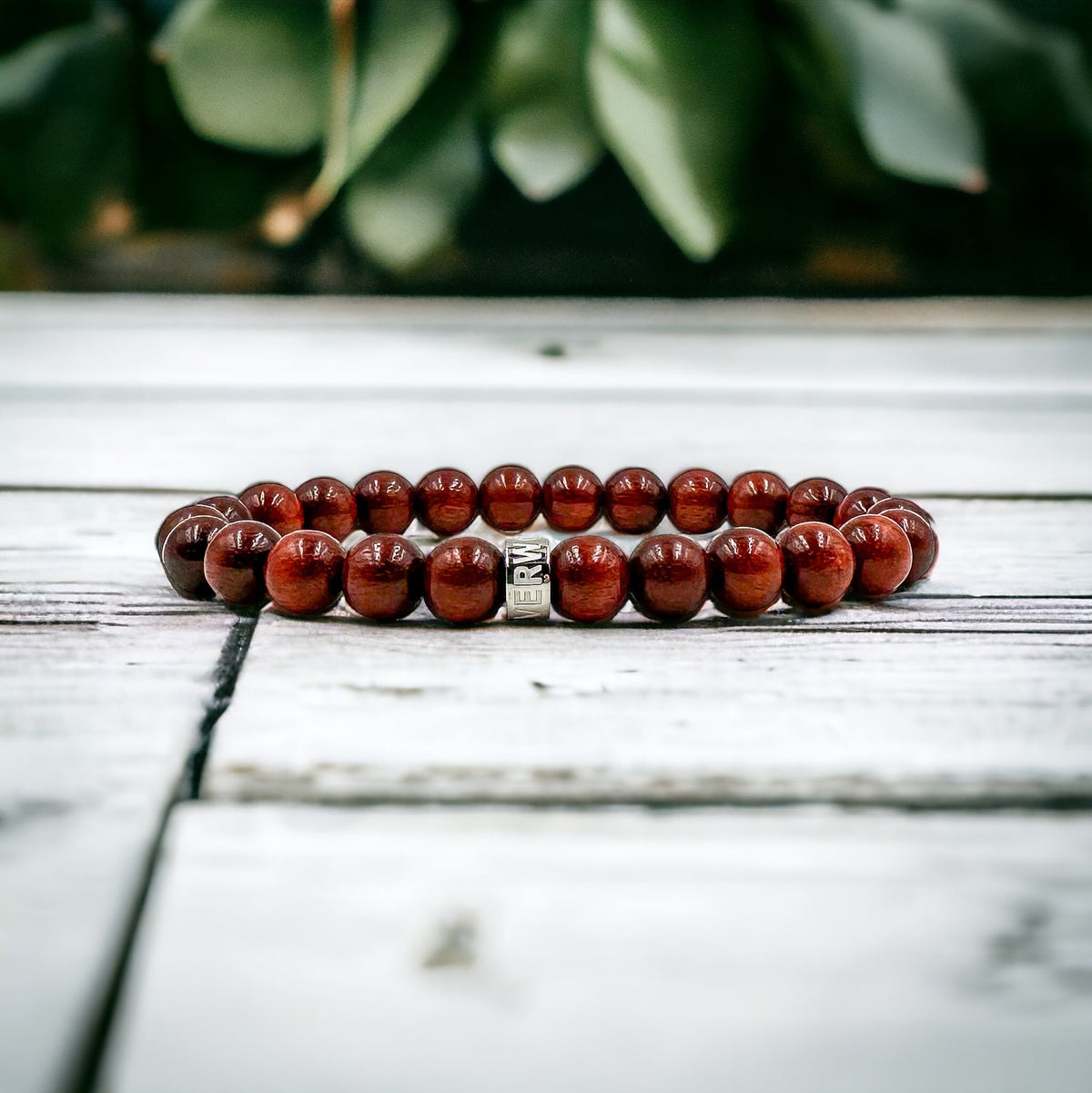 Cascade Flintshadow brazilian rosewood beaded bracelet, shown on a white wood surface