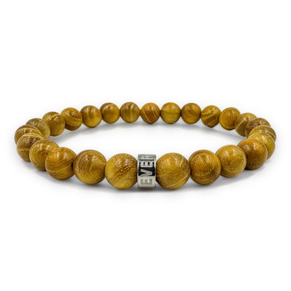 Cascade Yella Ember golden sandalwood beaded bracelet, low angle view