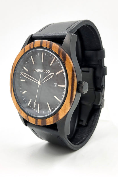 Inverness zebrawood wooden watch with black dial and black leather strap, angled close up