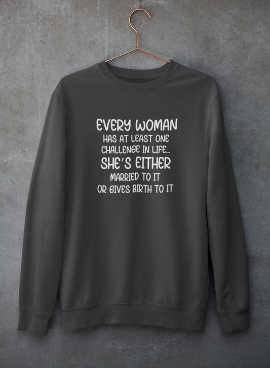 Black crewneck sweatshirt on a copper hanger against concrete, four-line joke in white.