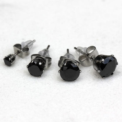 Black CZ stud earrings in four sizes with six prong settings on steel posts
