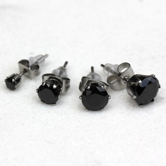 Black CZ stud earrings in four sizes with six prong settings on steel posts