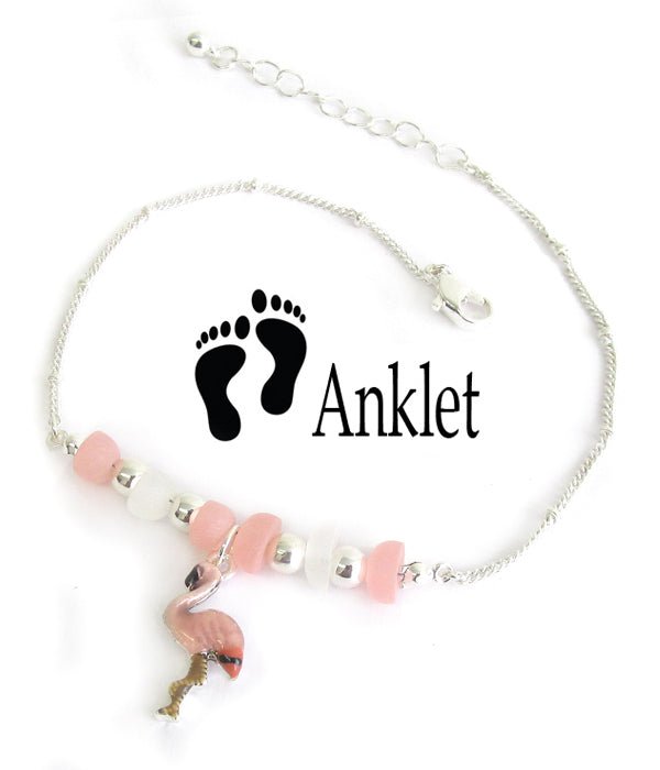 Flamingo anklet laid flat on white, showing the pink enamel flamingo, the glass beads and the extender chain