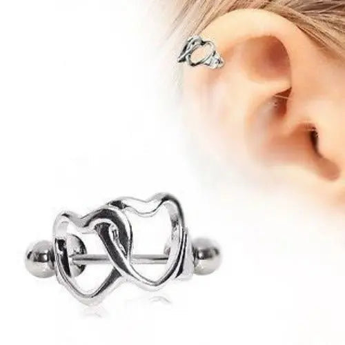 Interlocking open hearts cartilage cuff on a steel barbell, with an inset worn on the upper ear