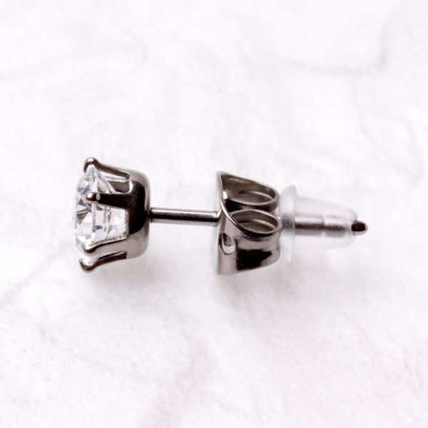 Side view of a titanium CZ stud with a clear rubber back on the post