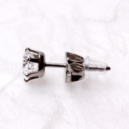Side view of a titanium CZ stud with a clear rubber back on the post