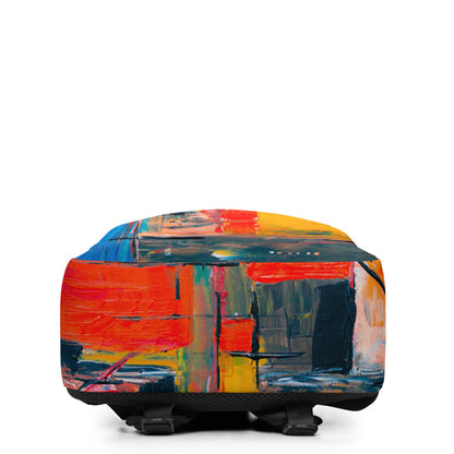 Backpack in an orange and blue abstract print, with a padded 15-inch laptop sleeve.