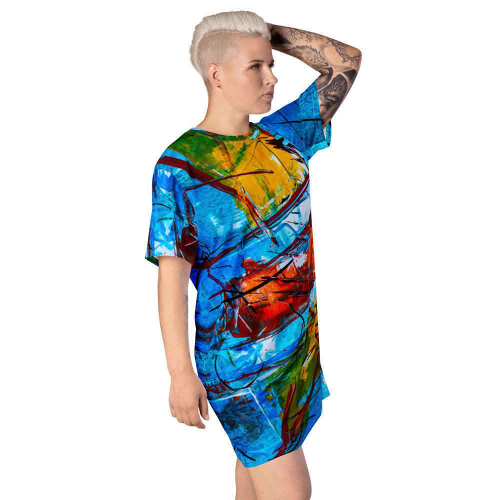 Relaxed T-shirt dress in blue and green abstract with orange breaking through the pattern.