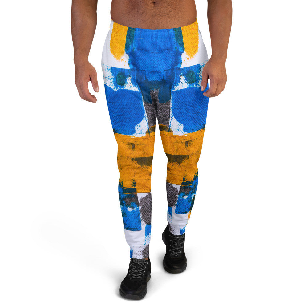 Men's joggers printed in blue, yellow and white blocks, with cuffed ankles.