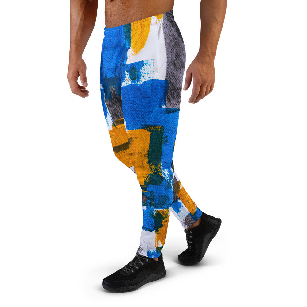 Men's joggers printed in blue, yellow and white blocks, with cuffed ankles.